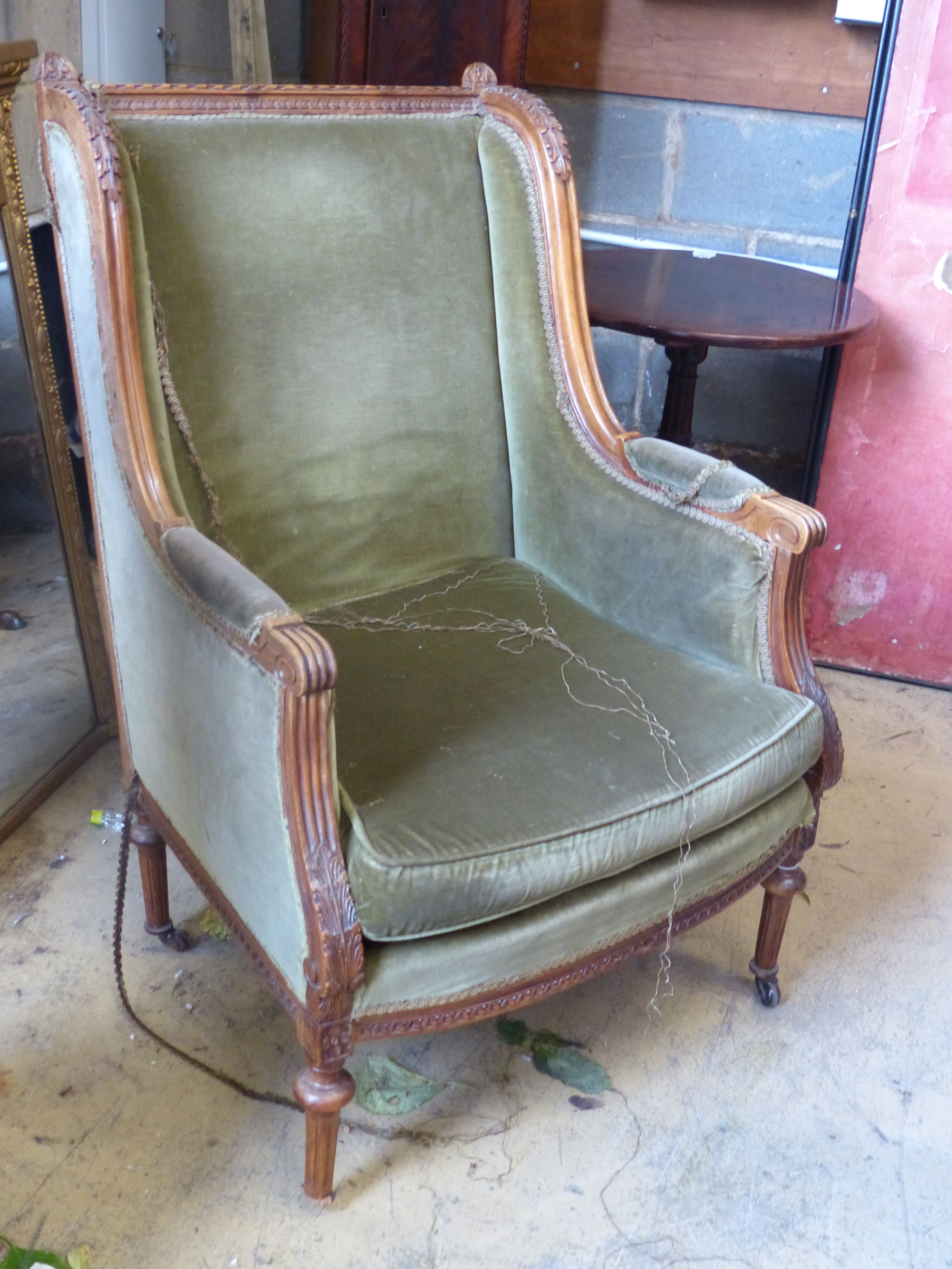 A Louis XVI style walnut framed fauteuil, with green dralon upholstery, width 67cm, depth 56cm, height 106cm